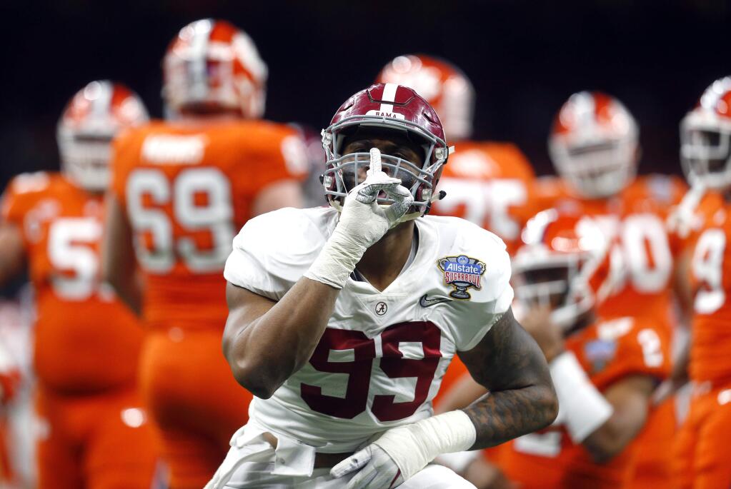 Alabama defensive lineman Raekwon Davis (99) reacts after a sack on Clemson quarterback Kelly Bryant (2) in the first half of the Sugar Bowl semi-final playoff game for the NCAA college football national championship, in New Orleans, Monday, Jan. 1, 2018. (AP Photo/Butch Dill)