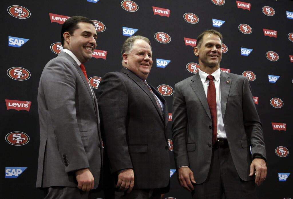 From left, San Francisco 49ers CEO Jed York, head coach Chip Kelly, and General Manager Trent Baalke pose for a photo after a media conference Wednesday, Jan. 20, 2016, in Santa Clara, Calif. (AP Photo/Ben Margot)