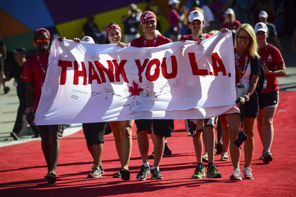 People carrying a Canadian banner arrive for the closing ceremonies of the Special Olympics World Games, Sunday, Aug. 2, 2015, in Los Angeles. (David Crane/Los Angeles Daily News via AP) NO SALES; MAGS OUT; HILLS OUT, LOS ANGELES TIMES OUT; VENTURA COUNTY STAR OUT ANTELOPE VALLEY PRESS OUT; MANDATORY CREDIT
