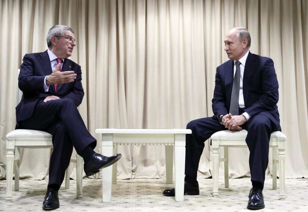 FILE - International Olympic Committee President Thomas Bach, left, talks during a meeting with Russian President Vladimir Putin at the Second European Games in Minsk, Belarus, June 30, 2019. In a sweeping move to isolate and condemn Russia after invading Ukraine, the International Olympic Committee urged sports bodies on Monday, Feb. 28, 2022, to exclude the country's athletes and officials from international events. (Sergey Bobylev, TASS/Sputnik, Kremlin Pool Photo via AP, File)
