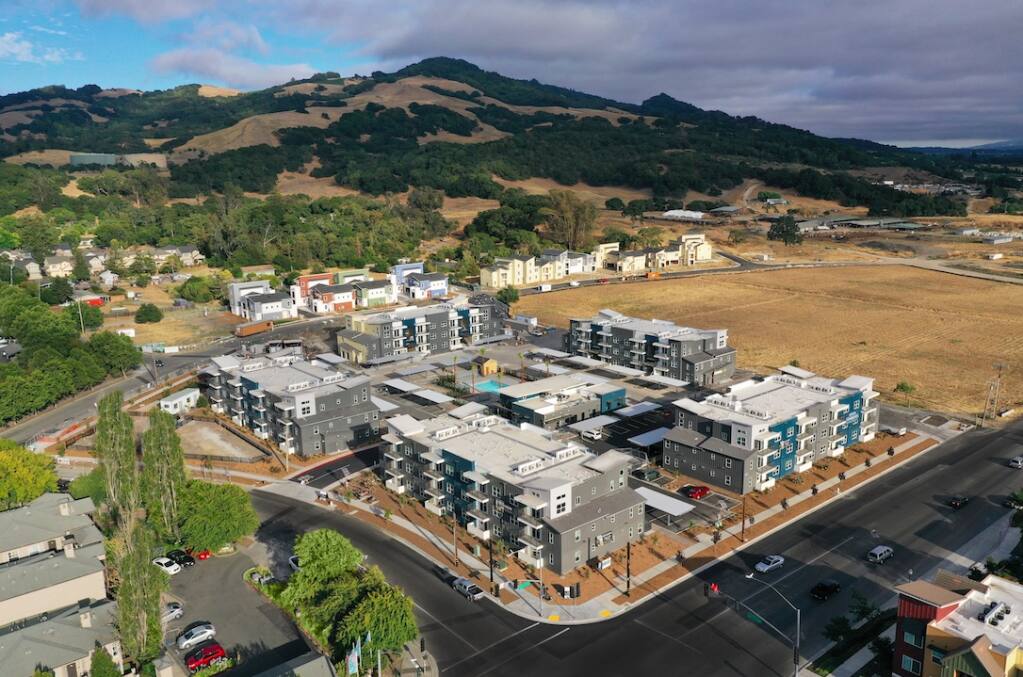The 120-unit first phase of the 38 Degrees North apartment project at 1020 Kawana Springs Road in southeast Santa Rosa is completed in 2020. Here, it’s seen from the northwest across the intersection with Petaluma Hill Road, with Taylor Mountain in the background. The vacant lot to the south is planned for the 172-unit second phase. (courtesy of Kennedy Wilson)