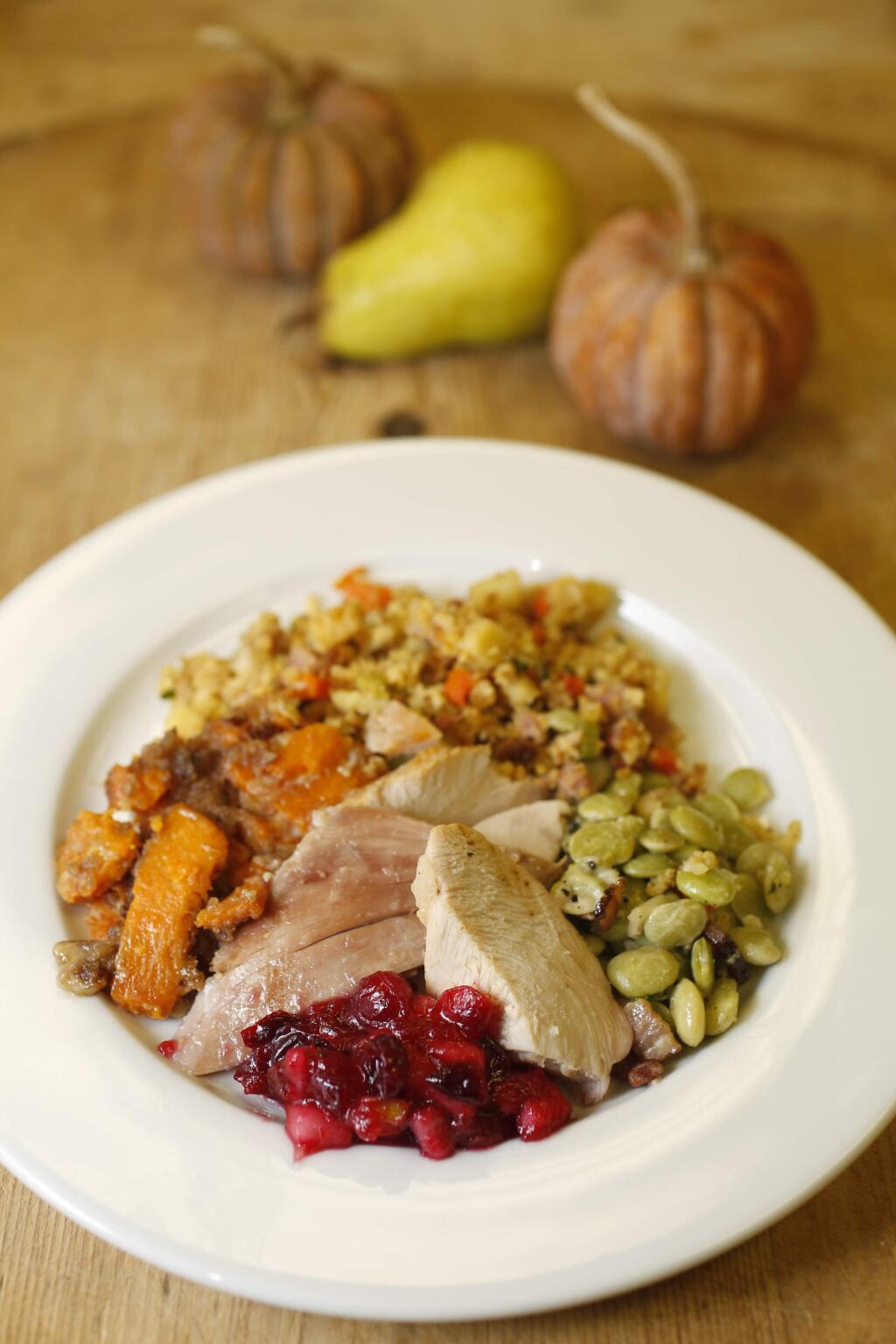 A plate of barbeque salt-rub turkey, scalloped sweet potatoes, cornbread stuffing, butter beans with bacon, and cranberry pear relish prepared with chef Annie Simmons during a Southern Thanksgiving cooking class at Ramekins in Sonoma on Sunday, Nov. 16, 2014. (BETH SCHLANKER/ PD)