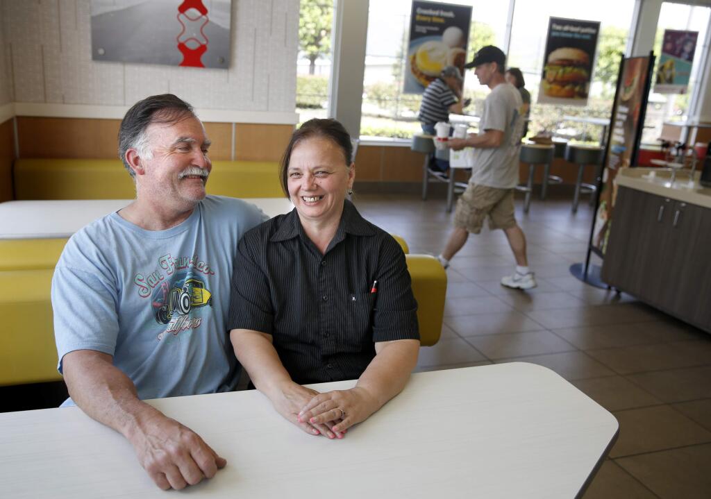 Debbie Huls and her husband Roscoe at the McDonald's where she works in Cloverdale, on Thursday, April 23, 2015. (BETH SCHLANKER/ The Press Democrat)