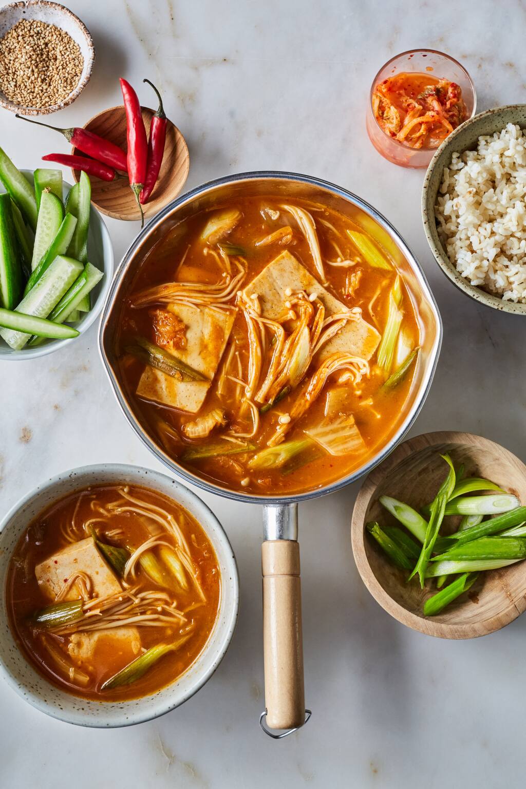 Kimchi Jjigae (Vegan Korean Soft Tofu and Kimchi Stew), from Dr. Linda Shiue’s cookbook “Spicebox Kitchen,” is traditionally cooked in a stone pot, but any heavy pot will work well. (Michelle K. Min/Go Hachette)