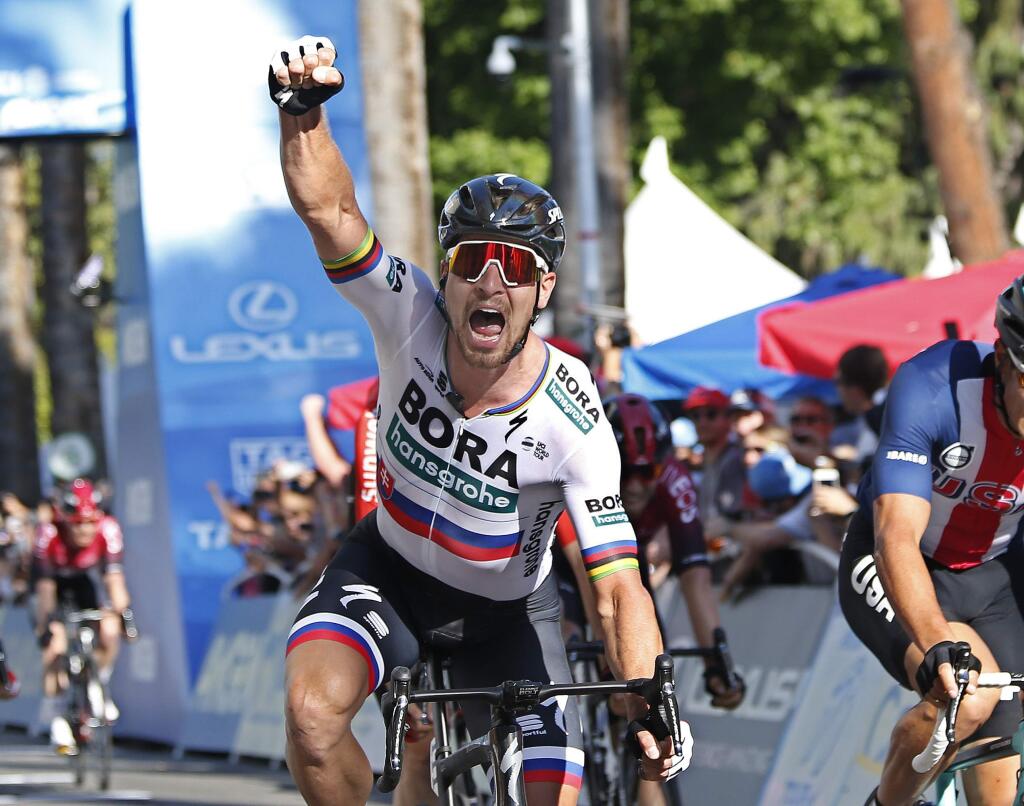 Peter Sagan, of the Bora-hansgrohe team, celebrates after crossing the finish line to win the first stage of the Amgen Tour of California cycling race Sunday, May 12, 2019, in Sacramento, Calif. (AP Photo/Rich Pedroncelli)