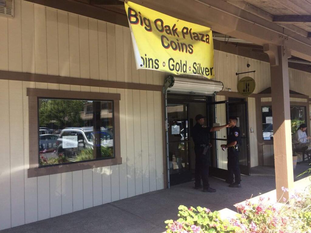 Officers at Big Oak Plaza Coins in Santa Rosa after an armed robbery there on Saturday, July 14, 2018. (SANTA ROSA POLICE DEPARTMENT)