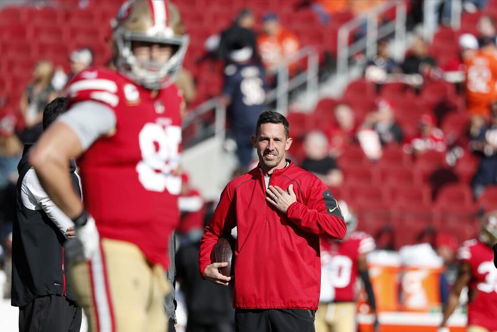 This Dec. 23, 2018, file photo shows San Francisco 49ers head coach Kyle Shanahan watching players warm up before a game against the Chicago Bears in Santa Clara. (AP Photo/Tony Avelar, File)