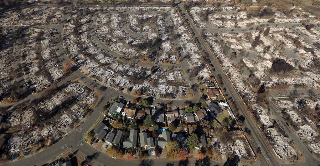 The Dogwood Drive area east of Coffey Park was nearly obliterated save for a few homes bordering Banyan Street and Banyan Place, bottom, by the October 2017 Tubbs fire in Santa Rosa. Hopper Lane is to the right. Despite extensive federal assistance, California's cities and counties are expected to foot at least half of the bill for the fires. (KENT PORTER / The Press Democrat)