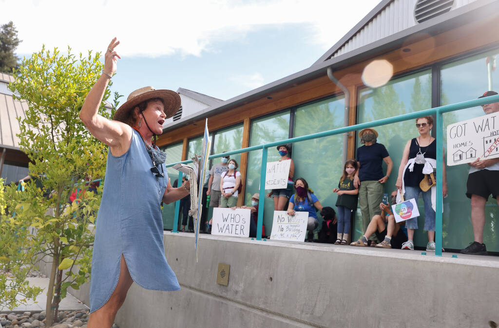 Former City of Healdsburg council member and Mayor Brigette Mansell speaks to protesters calling for the suspension of new water hookups at Healdsburg City Hall on Monday, Aug. 2, 2021. (Christopher Chung/ The Press Democrat)