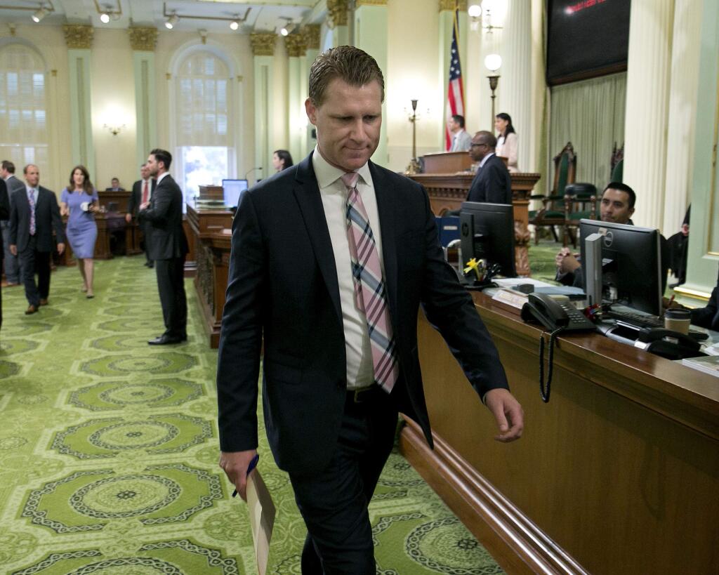 Assemblyman Chad Mayes of Yucca Valley leaves the Assembly floor to attend a GOP caucus meeting Thursday where he resigned as Assembly GOP Leader. (RICH PEDRONCELLI / Associated Press)