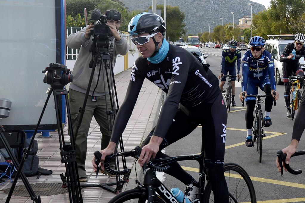 Britain's Chris Froome arrives back at his hotel after training in Palma de Mallorca, Spain, Wednesday Dec. 13, 2017. Froome failed a doping test during the Spanish Vuelta in September and is facing a suspension from cycling ahead of his attempt to win a record-equaling fifth Tour de France title next year. (AP Photo/Joan Llado)