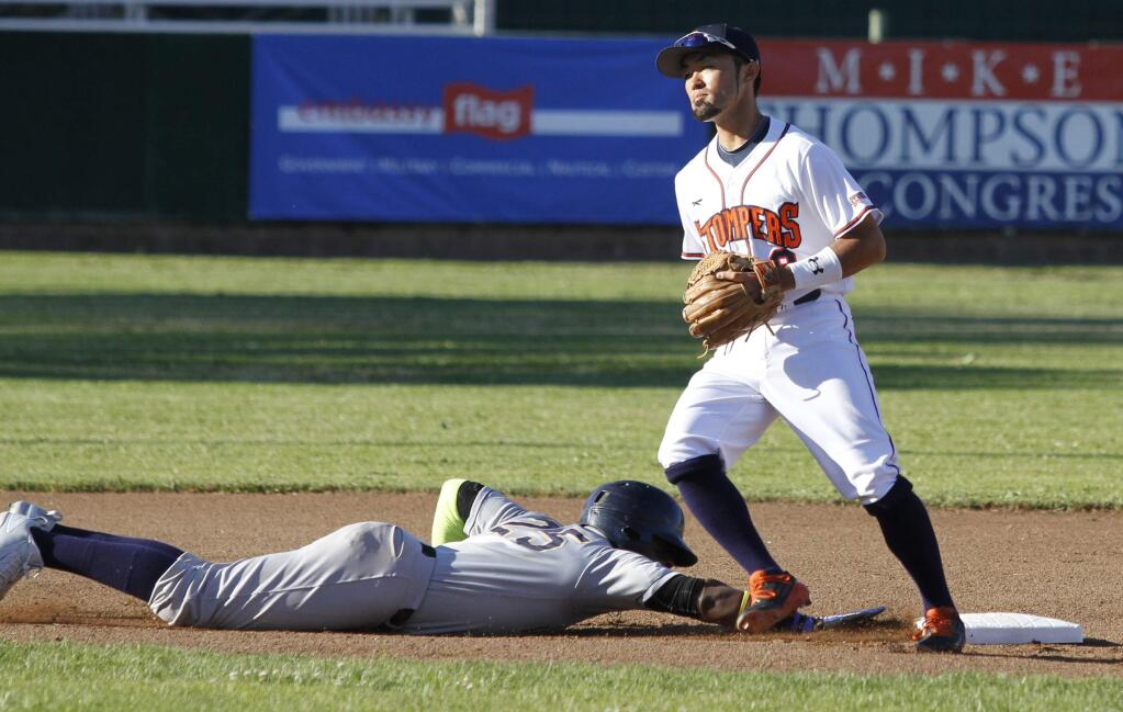 Bill Hoban/Index-TribuneStomper shortstop Yuki Yasuda dekes a runner back to second during a recent game. Yasuda hit his first home run of the season Wednesday as the Stompers beat Vallejo 16-12.