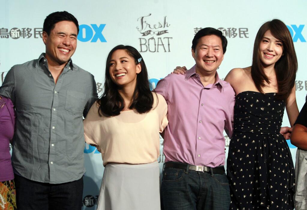 FILE - In this Aug. 5, 2016 file photo, Randall Park, from left, Constance Wu, Ken Jeong and Ann Hsu pose for photographers during a media event announcing their comedy series 'Fresh off the Boat' in Taipei, Taiwan. ABC‚Äôs ‚ÄúFresh Off the Boat‚Äù is coming to an end after six seasons. The network said Friday, Nov. 8, 2019, the comedy about an Asian American family in the 1990s will wrap with an hour-long finale. The last episode will air Feb. 21. (AP Photo/Chiang Ying-ying, File