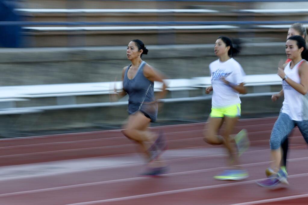 Grismel Alonso-Soto, left, does sprints during cross country practice at Santa Rosa Junior College in Santa Rosa, on Wednesday, October 4, 2017. (BETH SCHLANKER/ The Press Democrat)