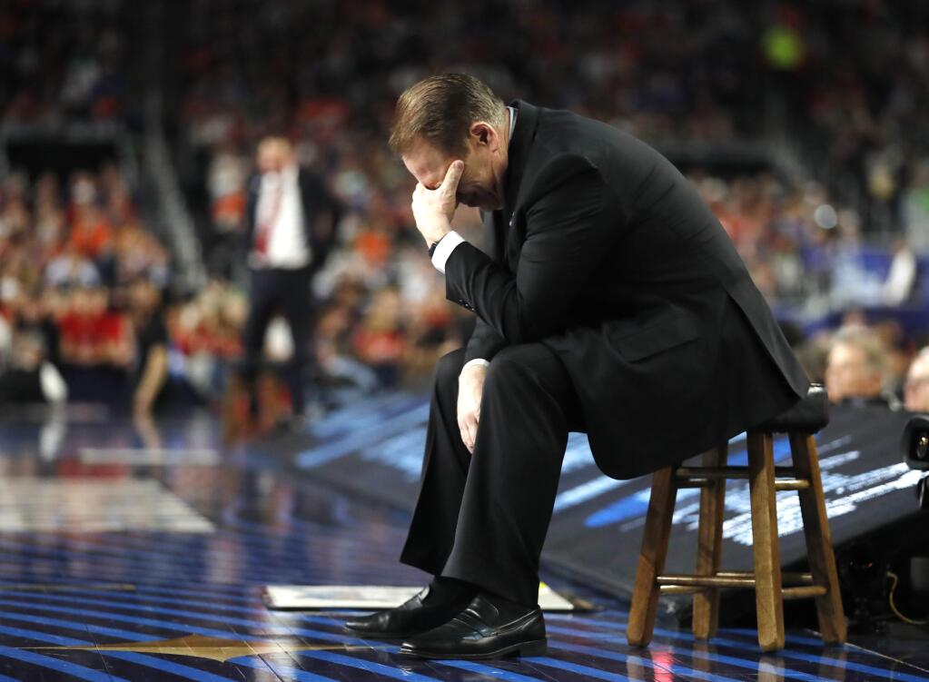 Michigan State head coach Tom Izzo reacts on the bench during the first half against Texas Tech in the semifinals of the Final Four NCAA college basketball tournament, Saturday, April 6, 2019, in Minneapolis. (AP Photo/Jeff Roberson)