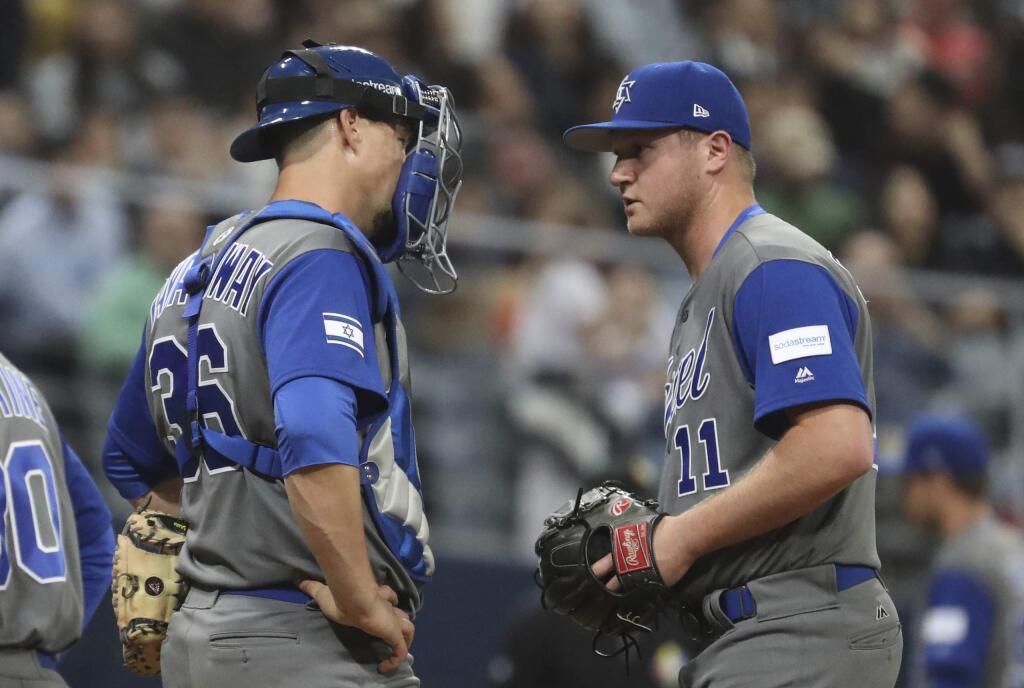 Israel pitcher Gabe Cramer, right, talks with catcher Ryan Lavarnway against South Korea during a first-round game of the World Baseball Classic at Gocheok Sky Dome in Seoul, South Korea, Monday, March 6, 2017. (AP Photo/Lee Jin-man)