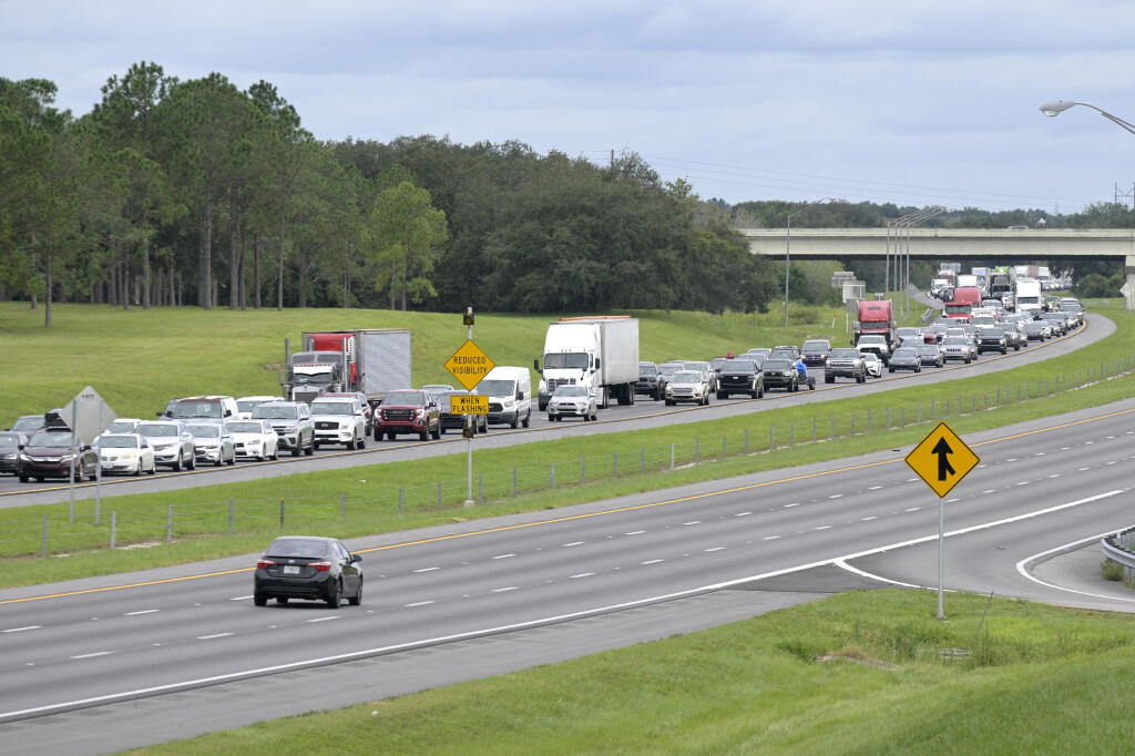 Eastbound traffic crowds Interstate 4 as people evacuate in preparation for Hurricane Ian approaches the western side of the state, Tuesday, Sept. 27, 2022, in Lake Alfred, Fla. (AP Photo/Phelan M. Ebenhack)