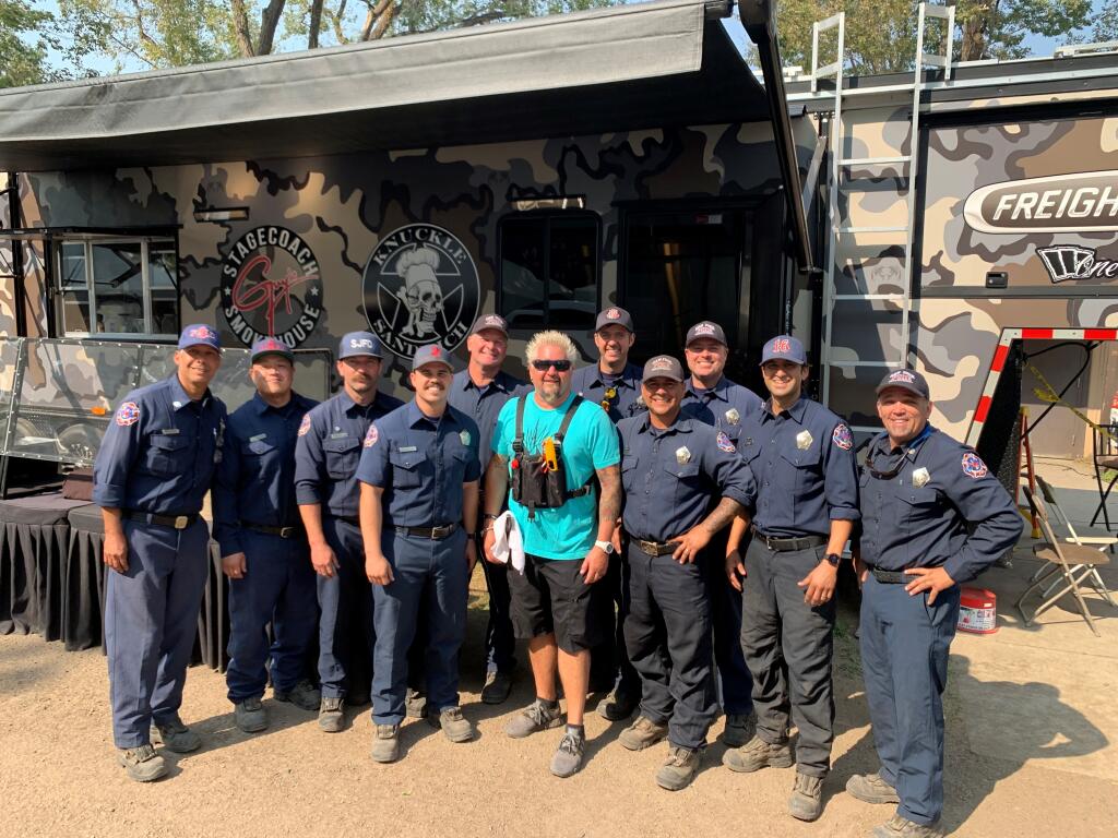 Guy Fieri poses with members of the San Jose Fire Department who have been battling the Dixie fire.  (San Jose Fire Department/Twitter)