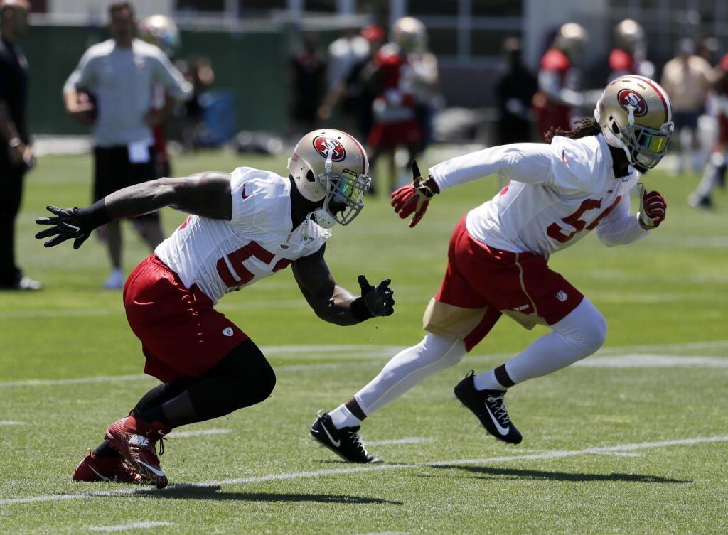 San Francisco 49ers' NaVorro Bowman, left, and Ray-Ray Armstrong go through drills during practice at the team's training facility Tuesday, June 13, 2017, in Santa Clara. (AP Photo/Marcio Jose Sanchez)