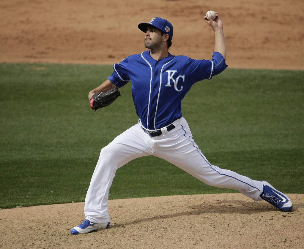 Kansas City Royals' pitcher Scott Alexander throws during the fifth inning of a spring training baseball game against the Chicago White Sox Saturday, March 5, 2016, in Surprise, Ariz. (AP Photo/Charlie Riedel)