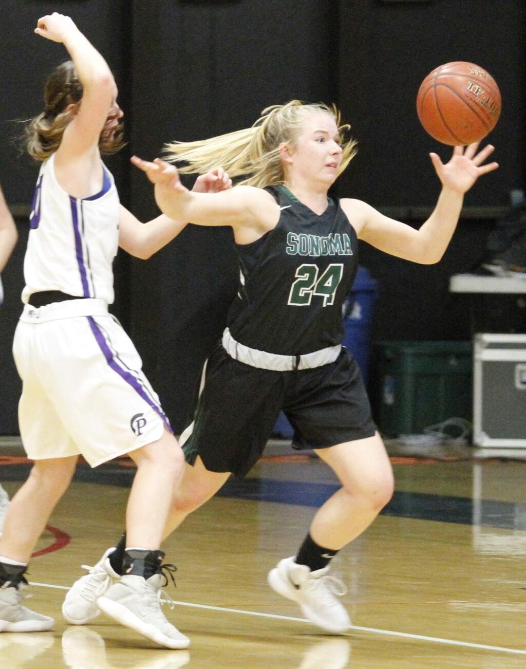 Bill Hoban/Index-TribuneSonoma's Alyssa Schimm tried to grab a loose ball during Friday night's Sonoma County League Championship game against Petaluma. Petaluma tied the game on a questionable foul call with 4.4 seconds, and went on to win in overtime.