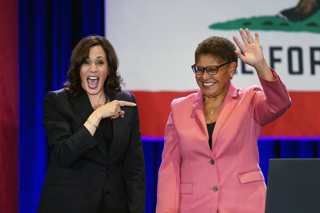 FILE - Vice President Kamala Harris, left, points to Los Angeles mayoral candidate U.S. Rep. Karen Bass, D-Calif., after speaking at a campaign rally in Los Angeles, Monday, Nov. 7, 2022. Bass, the first Black woman elected Los Angeles mayor, will be sworn-in as the 43rd Mayor of Los Angeles by Harris in an historic ceremony on Sunday, Dec. 11. (AP Photo/Jae C. Hong, File)