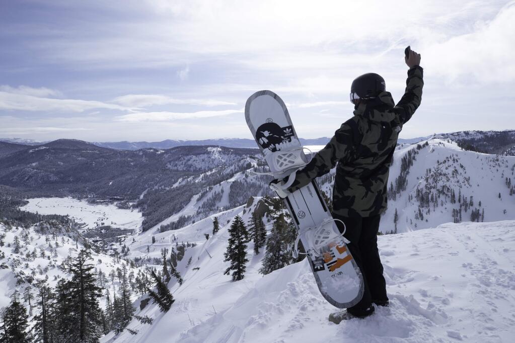 A snowboarder overlooks Squaw Valley Ski Resort Broken Arrow terrain. (BEN ARNST/ COURTESY OF SQUAW VALLEY ALPINE MEADOWS)