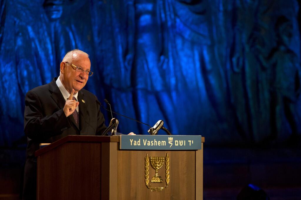 Israel's President Reuven Rivlin speaks at the opening ceremony of the Holocaust Remembrance Day at the Yad Vashem Holocaust Memorial in Jerusalem, Wednesday, April 15, 2015. (AP Photo/Sebastian Scheiner)