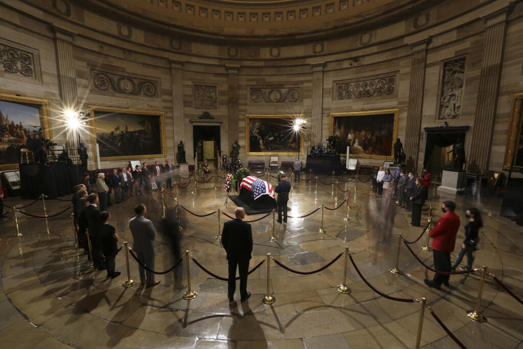The casket of former Sen. Robert Dole lies in state at the Rotunda of the U.S. Capitol in Washington, Thursday, Dec. 9, 2021.  (Oliver Contreras//The Washington Post via AP, Pool)