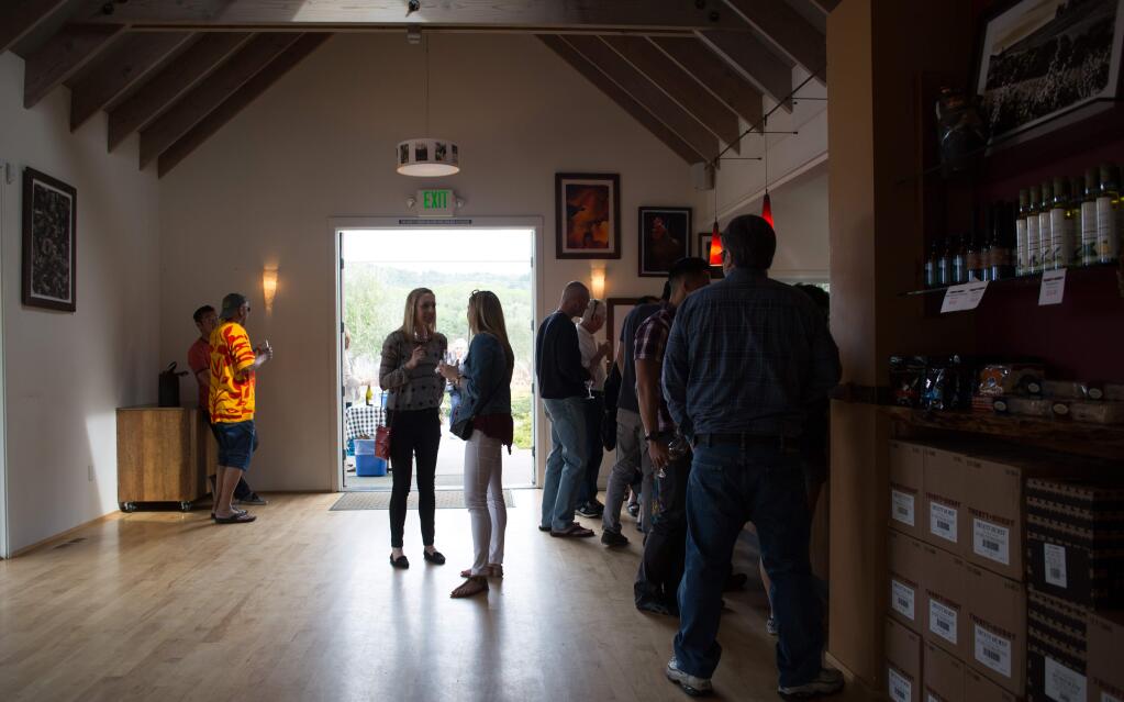 Visitors sample wines in the tasting room of Truett-Hurst Winery in Healdsburg in 2015. (JEREMY PORTJE/ PD FILE)