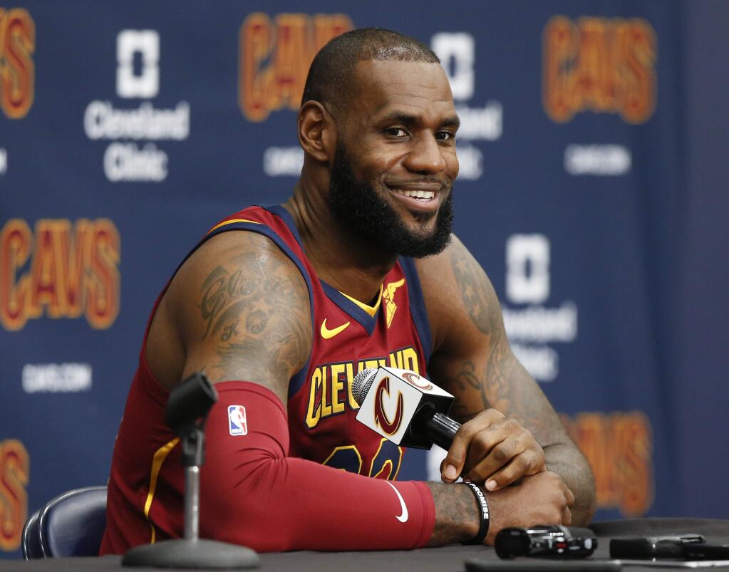 Cleveland Cavaliers' LeBron James answers questions during the NBA basketball team media day, Monday, Sept. 25, 2017, in Independence, Ohio. (AP Photo/Ron Schwane)