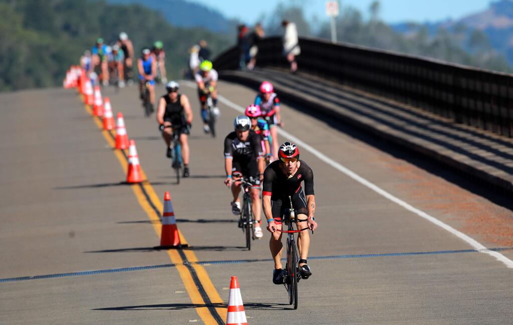 Bikers head across the bridge at Lake Sonoma during Santa Rosa Ironman race on Saturday, May 12, 2018. (JOHN BURGESS/ PD FILE)