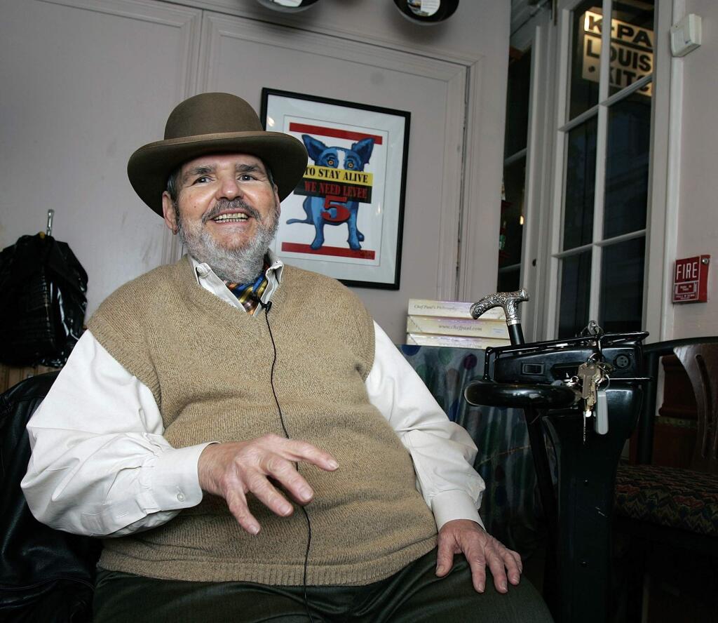 FILE -In this Friday, Feb. 2, 2007 file photo, chef Paul Prudhomme gestures during an interview at his French Quarter restaurant, K-Paul's Louisiana Kitchen, in New Orleans. Prudhomme, the Cajun who popularized spicy Louisiana cuisine and became one of the first American restaurant chefs to achieve worldwide fame, died Thursday, Oct. 7, 2015. He was 75. (AP Photo/Bill Haber, File)