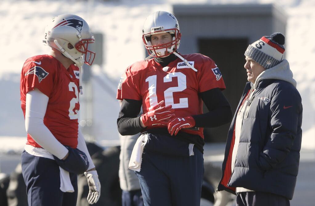 New England Patriots quarterbacks Brian Hoyer, left, and Tom Brady, center, stand with head coach Bill Belichick, right, during practice, Thursday, Jan. 18, 2018, in Foxborough, Mass. The Patriots host the Jacksonville Jaguars in the AFC championship on Sunday in Foxborough.(AP Photo/Steven Senne)