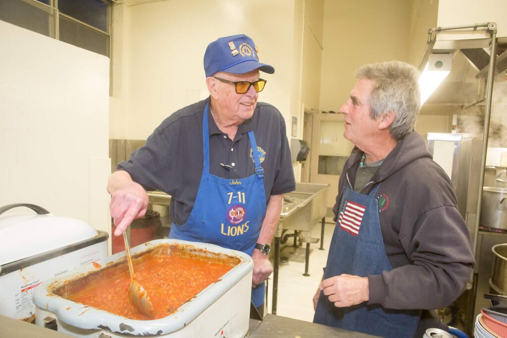 John Finkbohner, left, and Tom Kelly prepare side-dishes during the Petaluma 7-11 Lions 35th annual crab feed at the Petaluma Veterans Memorial Building in Petaluma, Calif. Saturday, January 21, 2017. Finkbohner has worked the crab feed for all 35 years. (Jeremy Portje / For The Press Democrat)
