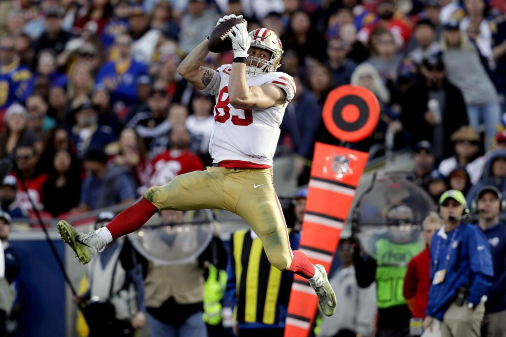 FILE - In this Dec. 30, 2018, file photo, San Francisco 49ers tight end George Kittle catches a pass against the Los Angeles Rams during the first half in an NFL football game in Los Angeles. No tight end has ever been as prolific with the ball in his hands as Kittle was for the 49ers last season when he used his speed and ability to run after the catch to record the most yards receiving ever in a season for a tight end. (AP Photo/Marcio Jose Sanchez, File)