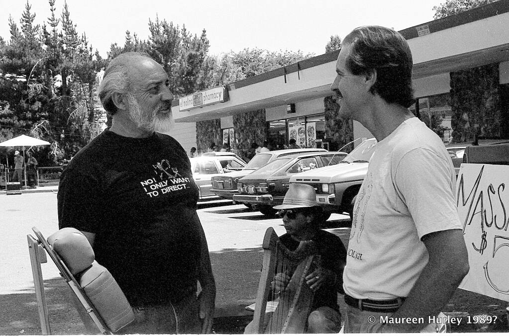 Guerneville resort owner, community leader and singer Alby Kass, left, talks with a local at Forestville's third annual Poison Oak Festival and summer sidewalk sale in 1989. (Maureen Hurley)