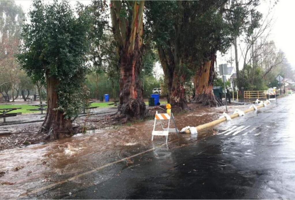 Image of flooding along First St. West, an area that has since seen improved drainage from a city public works project. It will be given the acid test this week, as a powerful storm is poised to sweep across Sonoma County. (Photograph: Sonoma County Water Agency)