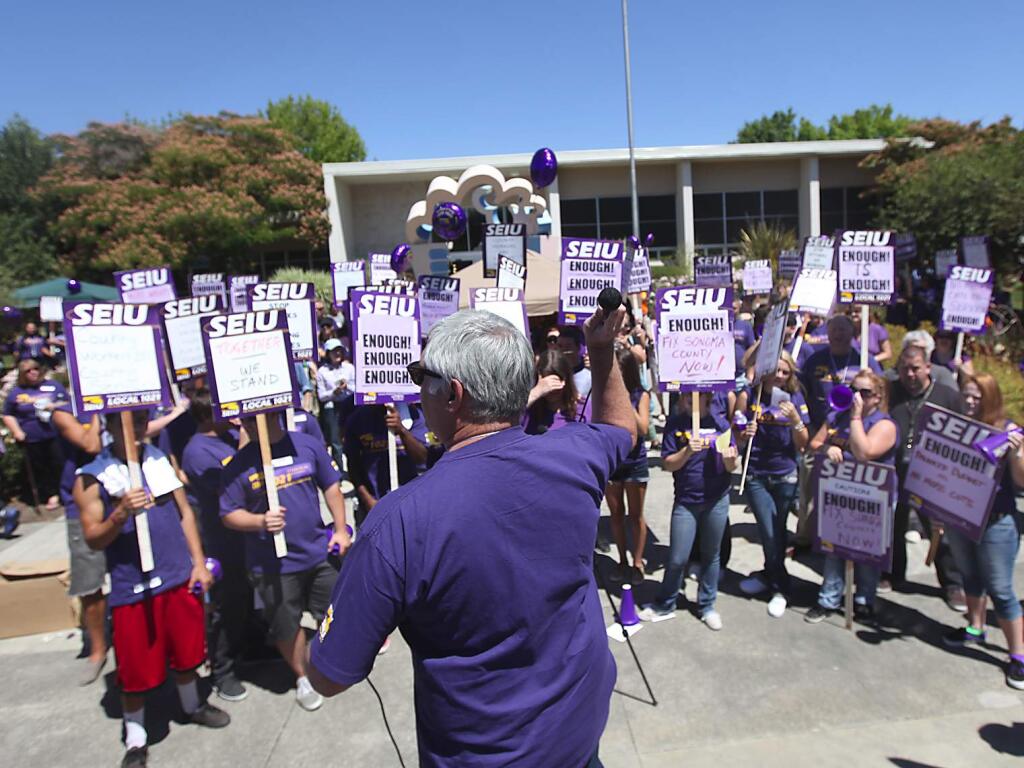 SEIU 1021 union members with the County of Sonoma rally in front of the Sonoma County Board of Supervisors, Tuesday July 31, 2012 in Santa Rosa. (Kent Porter / Press Democrat) 2012