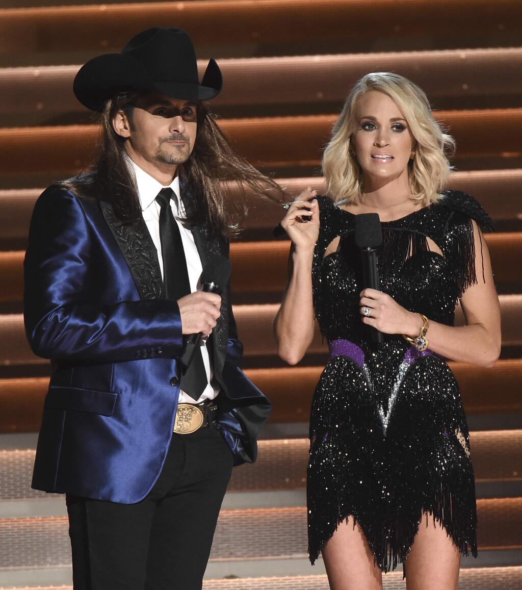 Hosts Brad Paisley and Carrie Underwood speak at the 50th annual CMA Awards at the Bridgestone Arena on Wednesday, Nov. 2, 2016, in Nashville, Tenn. (Charles Sykes/Invision/AP)