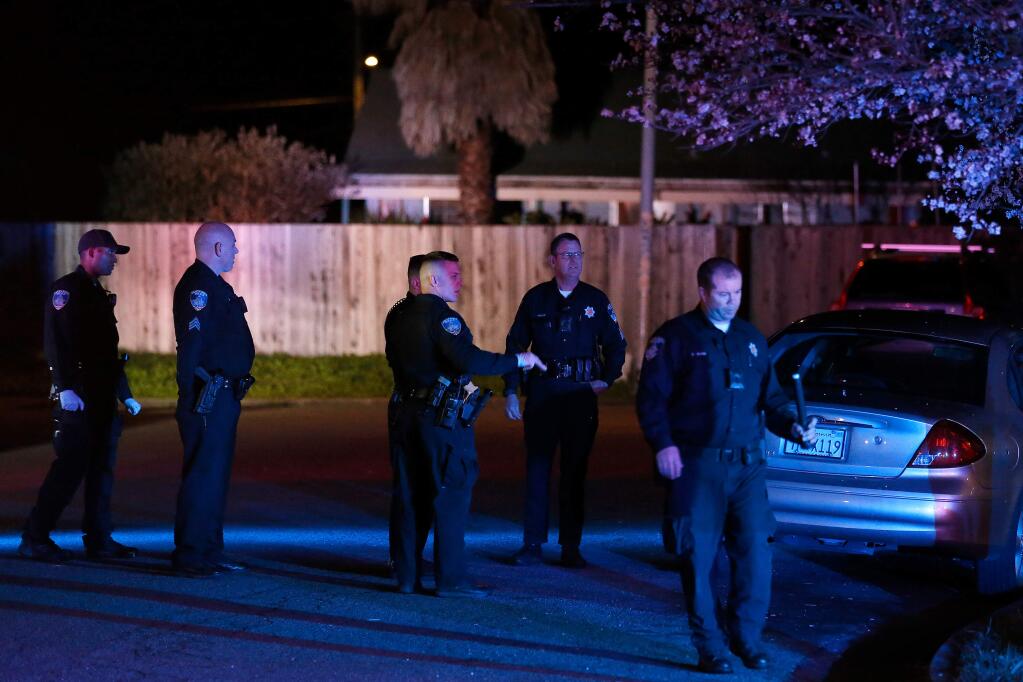 Santa Rosa Police officers investigate the scene of a shooting on Tan Oak Court in Santa Rosa, California, on Friday, March 8, 2019. (Alvin Jornada / The Press Democrat)