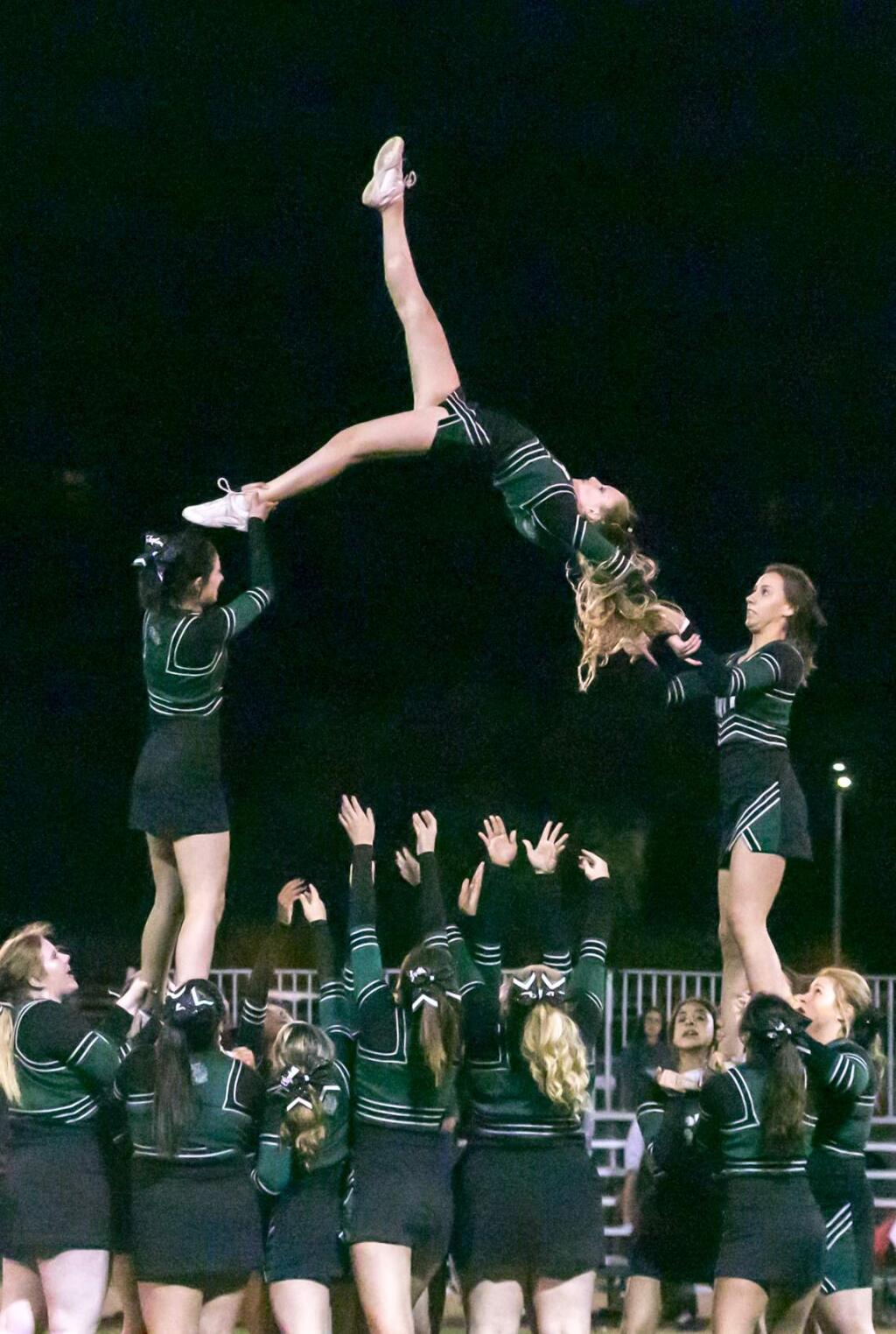 Cheerleaders for the Sonoma Valley High School football team at the Dragons' home game vs. Montgomery, Friday, Sept. 16, 2016. (Photo by Julie Vader/special to the Index-Tribune)