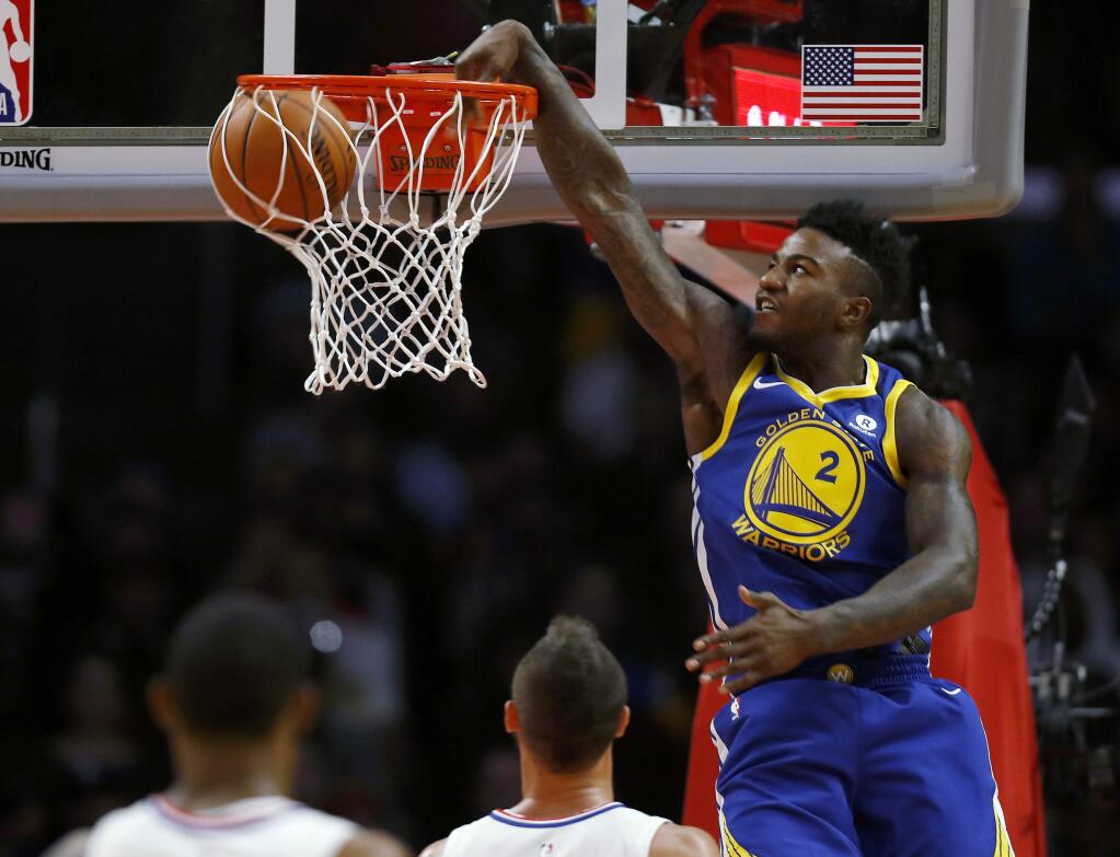 Golden State Warriors forward Jordan Bell dunks the basketball during the first half of an NBA basketball game against the Los Angeles Clippers, Monday, Oct. 30, 2017, in Los Angeles. (AP Photo/Ryan Kang)