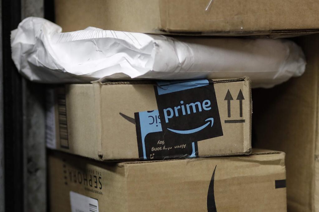 A package from Amazon Prime is loaded for delivery on a UPS truck. (AP Photo/Mark Lennihan, File)