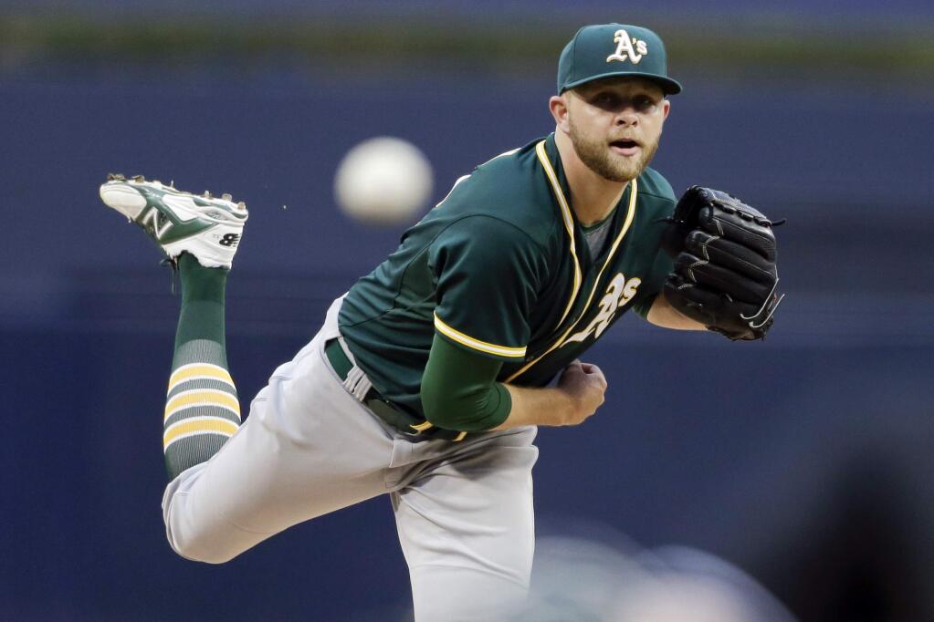 Oakland Athletics starting pitcher Jesse Hahn works against a San Diego Padres batter during the first inning of a baseball game Monday, June 15, 2015, in San Diego. (AP Photo/Gregory Bull)