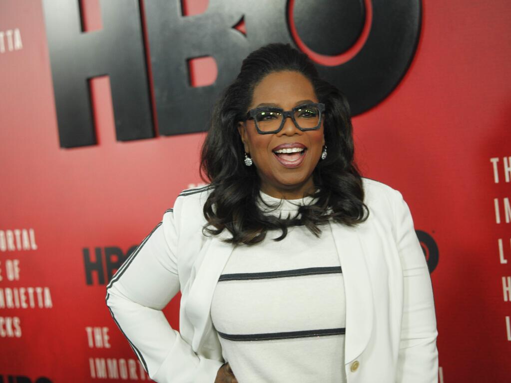 FILE - In this April 18, 2017, file photo, Oprah Winfrey attends the premiere of HBO Films' 'The Immortal Life of Henrietta Lacks' at the SVA Theatre in New York. Winfrey told Vogue magazine for an article published online Aug. 14, 2017, that hat the high-profile fluctuations in her weight over the years were “a physical, spiritual, emotional burden” burden for her, but at 63, she says there are no more apologies. (Photo by Andy Kropa/Invision/AP, File)