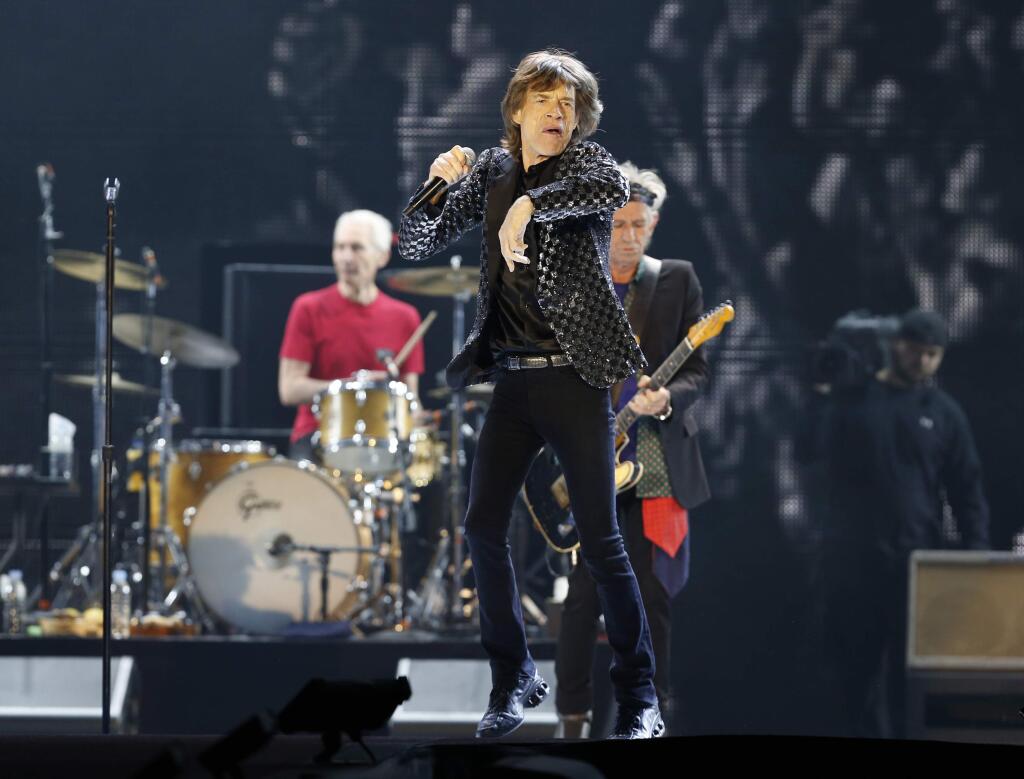 FILE - This Feb. 26, 2014 file photo shows Mick Jagger and the Rolling Stones performing during their concert at Tokyo Dome in Tokyo. The band has announced that they will kick off their new 15-city North American stadium tour (AP Photo/Shizuo Kambayashi, File) The rock band announced a 15-city stadium tour Tuesday, March 31, 2015, that will kick off May 24 in San Diego. Other stops include Columbus, Ohio; Minneapolis, Minnesota; Dallas, Texas; Atlanta, Georgia; Orlando, Florida; and Nashville, Tennessee. (AP Photo/Shizuo Kambayashi)