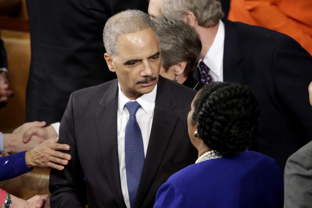 Attorney General Eric Holder talks with Rep.Sheila Jackson Lee, D-Texas, on Capitol Hill in Washington, Tuesday, Jan. 20, 2015, before President Baraclk Obama's State of the Union address before a joint session of Congress. (AP Photo/Pablo Martinez Monsivais)