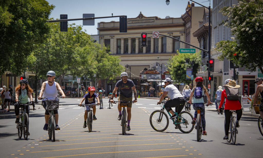The debut of Petaluma Ciclovia had crowds of cyclists and pedestrians exploring the access to portions of Petaluma Boulevard which was closed to cars for two hours on Sunday, July 17, 2022._Petaluma, CA, USA._(CRISSY PASCUAL/PETALUMA ARGUS-COURIER STAFF)
