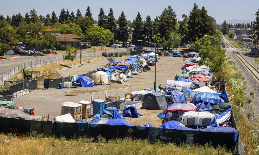Businesses surrounding the city sanctioned homeless encampment in the park and ride on Roberts Lake Road in Rohnert Park are not happy the Rohnert Park city council declined to help local businesses with security cameras or hire a guard to mitigate the impacts of the encampment Wednesday, June 29, 2022. (John Burgess / The Press Democrat)